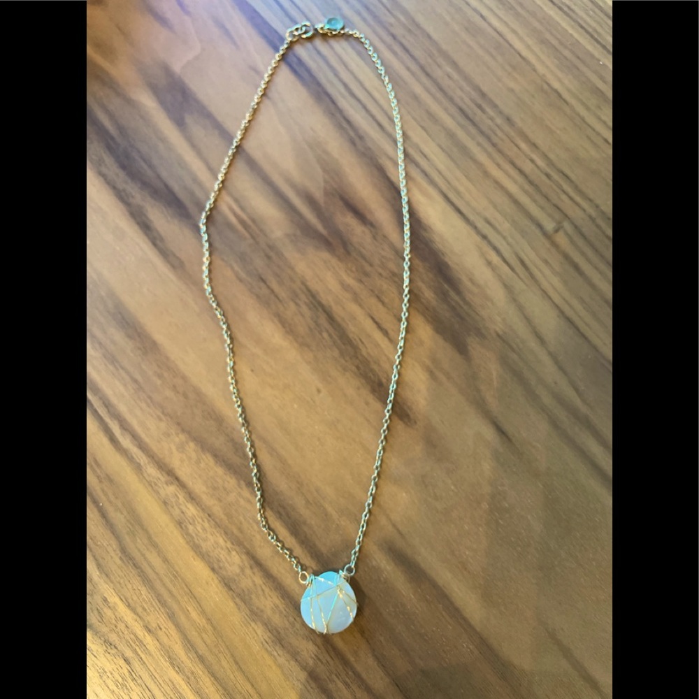 Gold wrapped ivory stone necklace